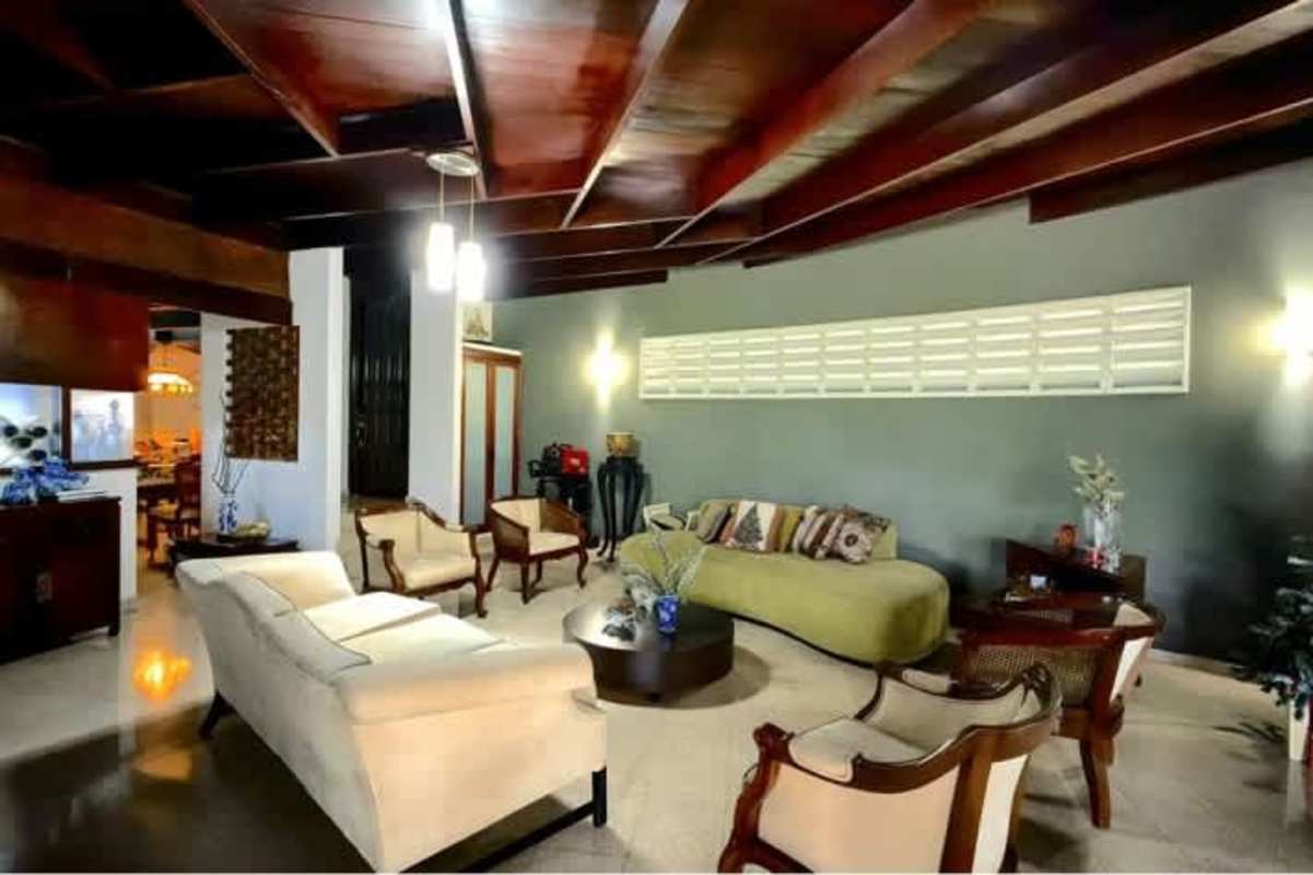 Shaded patio with garden view, ideal outdoor living space, mid-century house in Obarrio Panama City