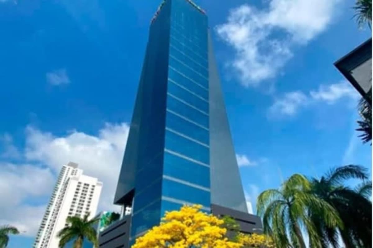 Modern lobby with glass walls, striped floors, reception desk in PH Oceania Business Plaza Panama City