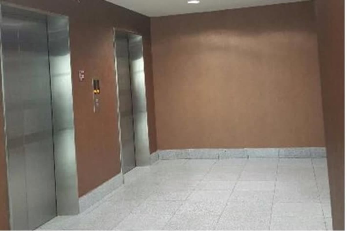 Interior hallway glass partitions elevator lobby PH Top Tower Costa del Este Panama