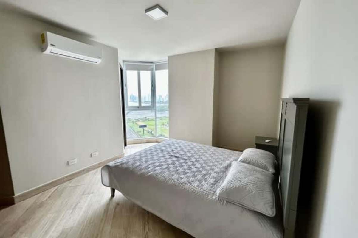 Resort style swimming pool with lounge chairs at Costa del Este Paramount Casa Club