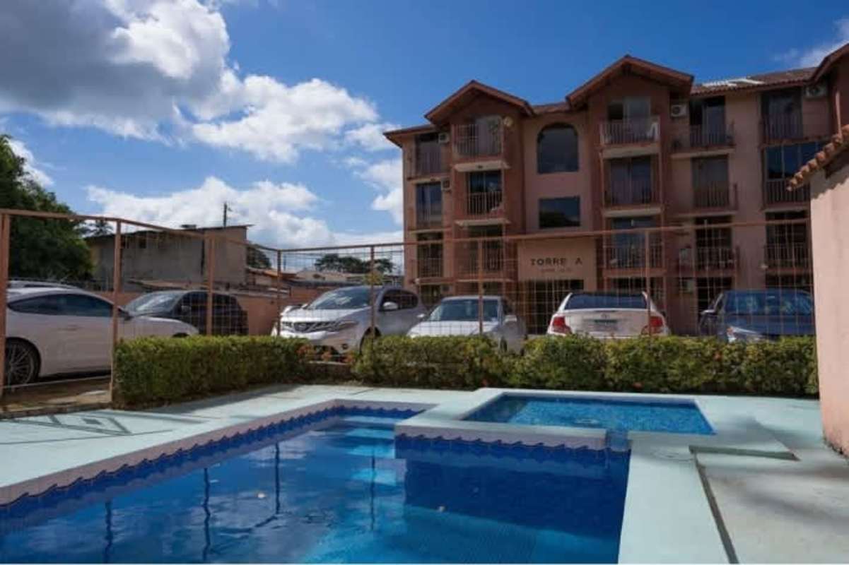 Facade of mid-rise PH Chanis Garden with balconies and parking area Chanis Panama