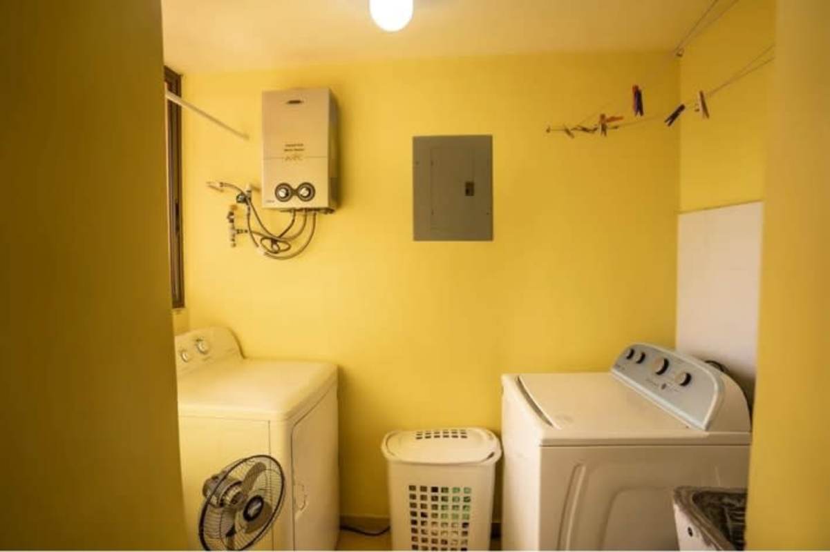 Laundry space with washing machine, dryer, water heater PH Chanis Garden Panama City