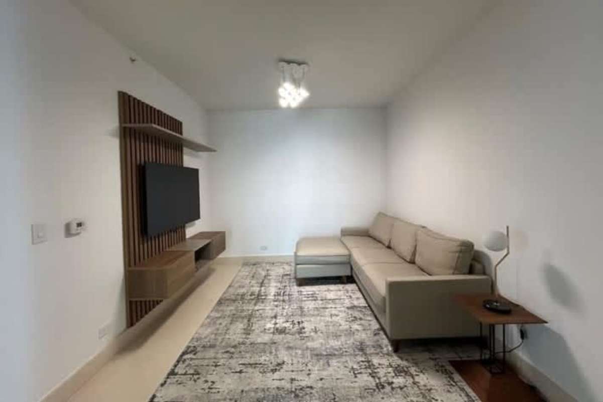 Elegant master bedroom with floor-to-ceiling windows featuring ocean panorama at PH Punta Paitilla luxury rental