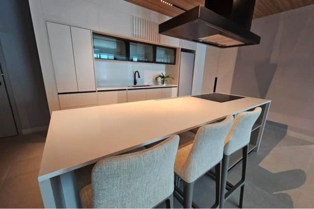 High-end minimalist kitchen with island and integrated appliances in PH MARQUEE