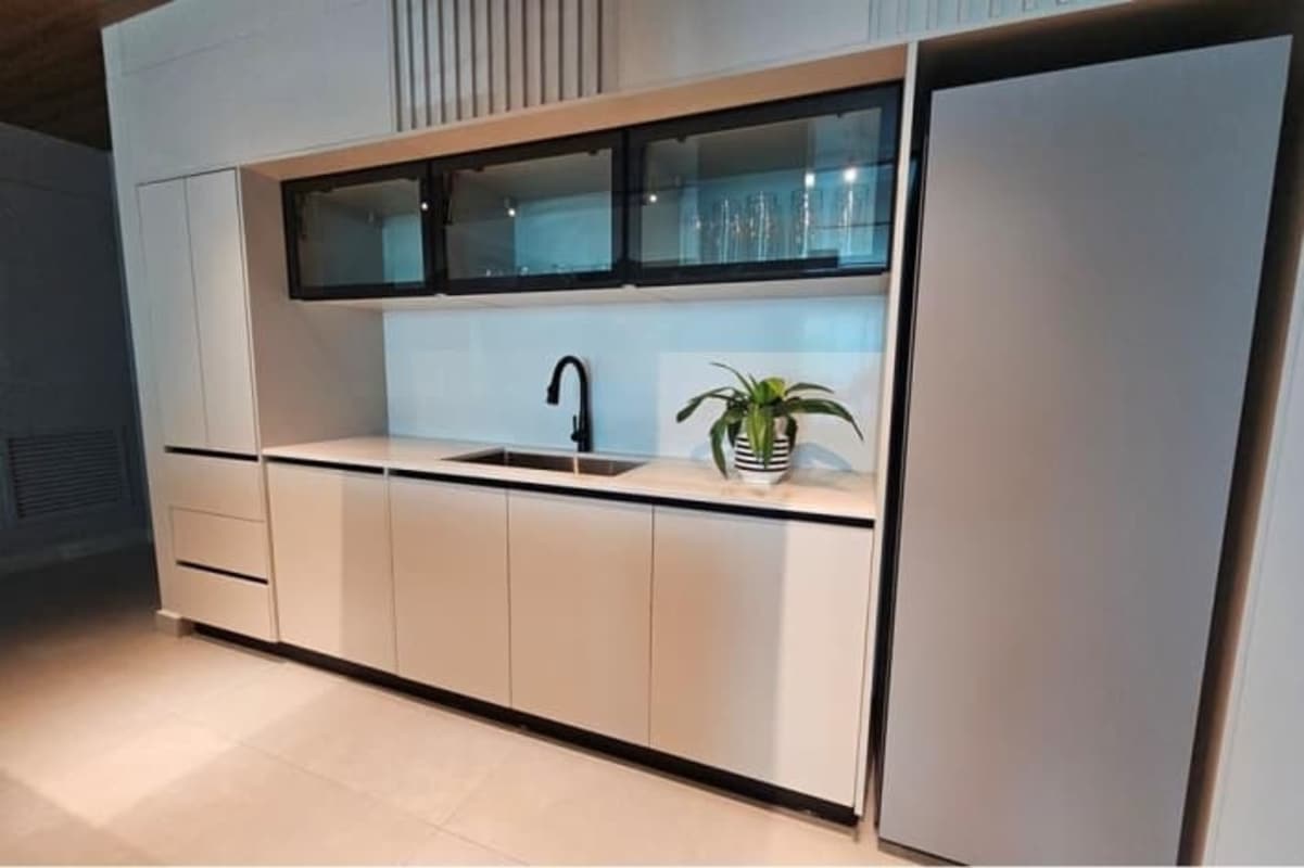 Minimalist kitchen with island, built-in cabinetry, wood accents PH Marquis Marbella Panama