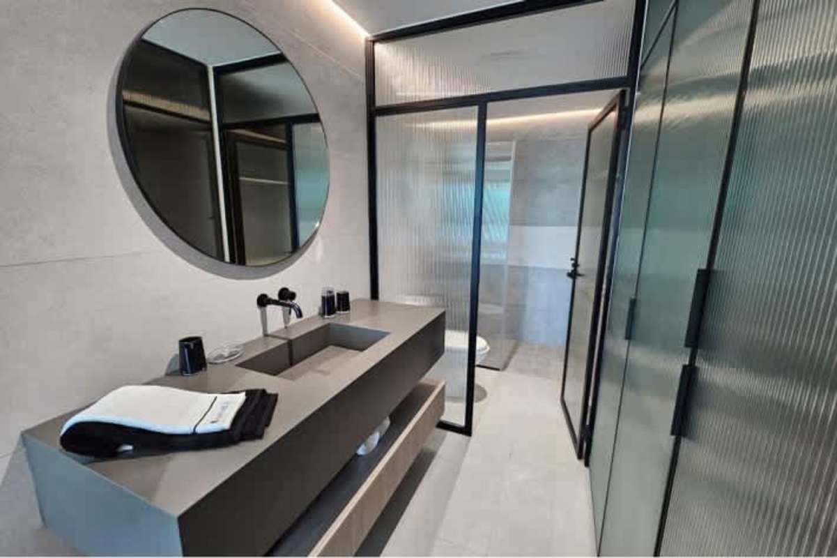 Modern living room with sliding glass balcony door, tufted sofa PH Marquis Panama