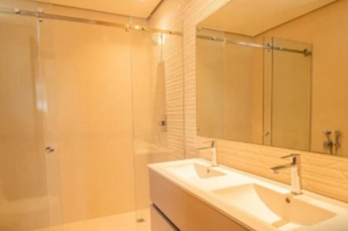 Elegant bathroom with double vanity and glass shower Costa del Este Panama