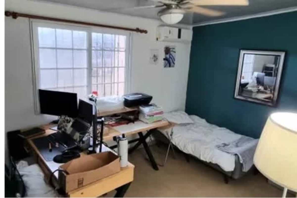 Covered patio with metal railing, plants, seating, hammock in Don Bosco residential house Panama