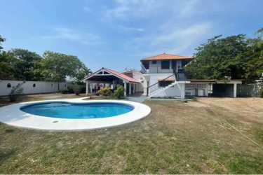 Large private swimming pool with deck and garden at Punta Chame beachfront house