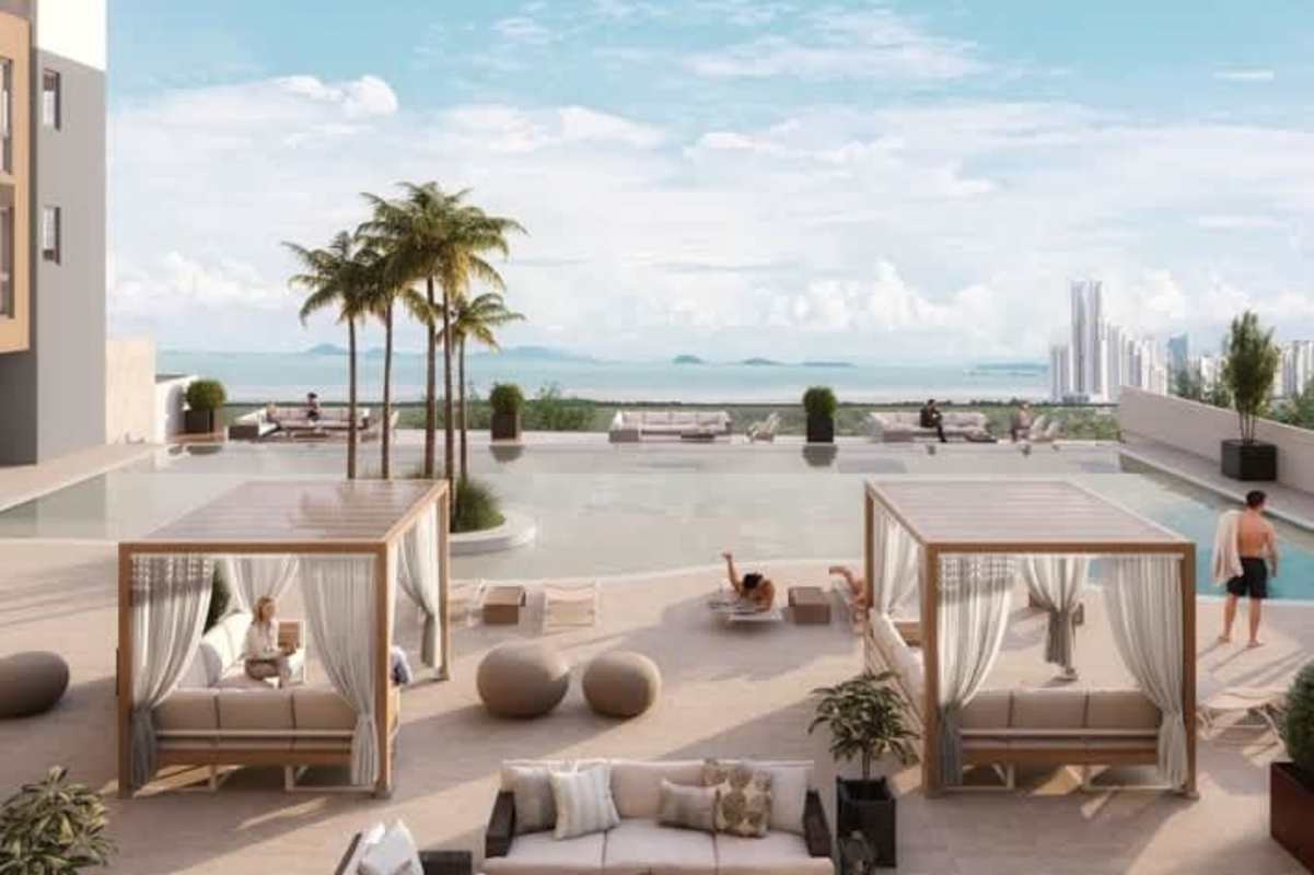 Infinity edge rooftop pool deck with skyline and ocean view at Oceana Santa Maria Panama