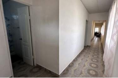 Spacious interior living dining space with ceiling fan ceramic tile Punta Chame villa