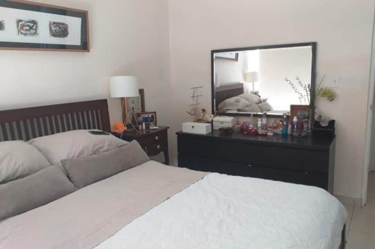 Contemporary living room with gray sofa, TV, wall art in PH San Francisco Bay Panama City