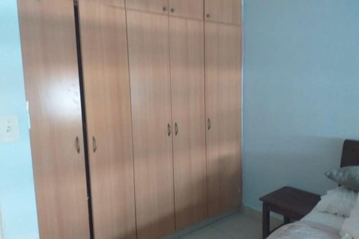 Gym room with weight machines, mirrors and rubber floor in PH San Francisco Bay Panama City