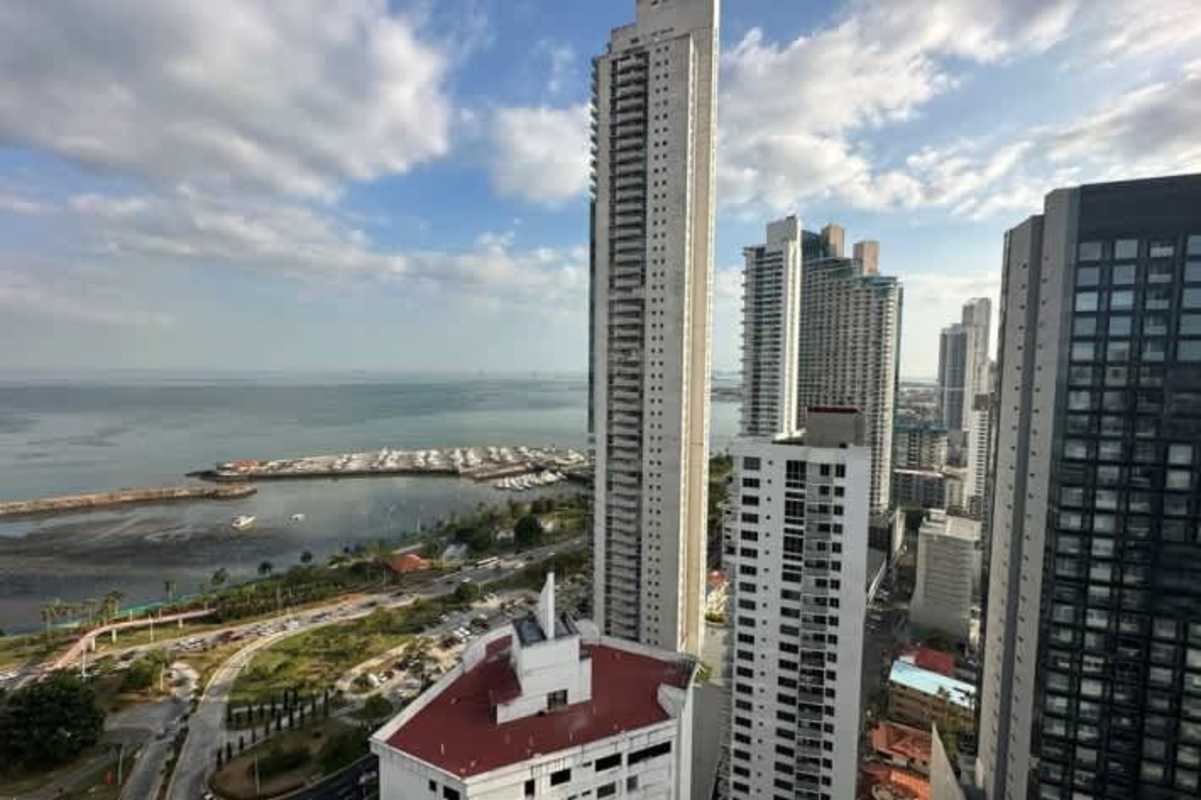 Compact modern kitchen with granite counters and appliances in PH Colores de Bella Vista Panama