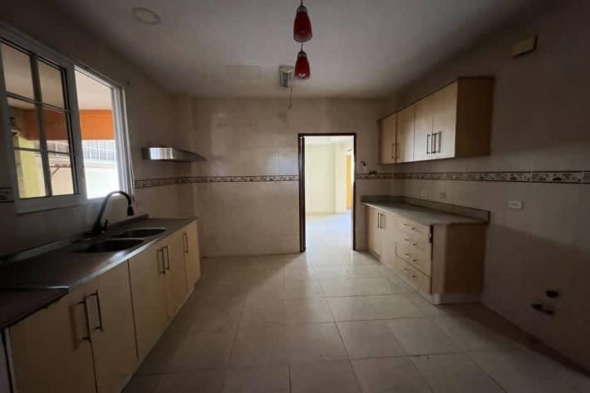 Large bright living room with tiled floors, double doors to garden, in PH Las Huacas Rainforest Village Panama