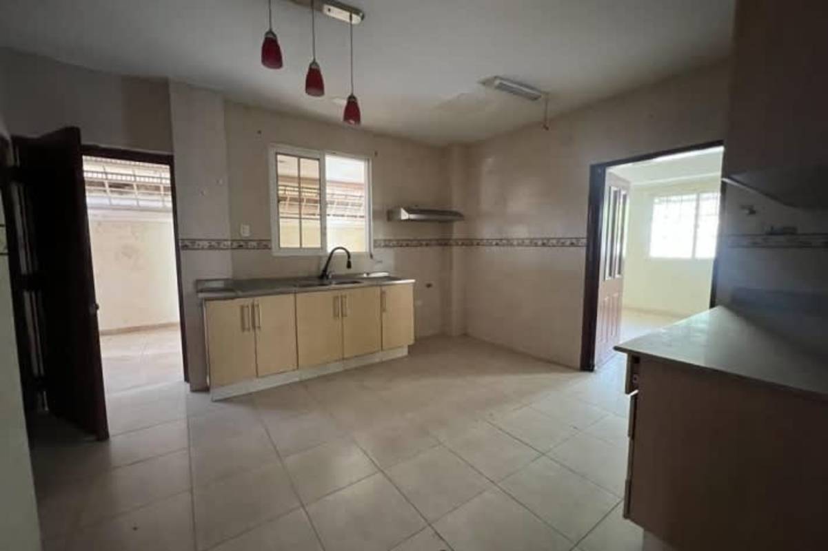Bedroom with closet, tiled flooring and bright window in PH Las Huacas Panama