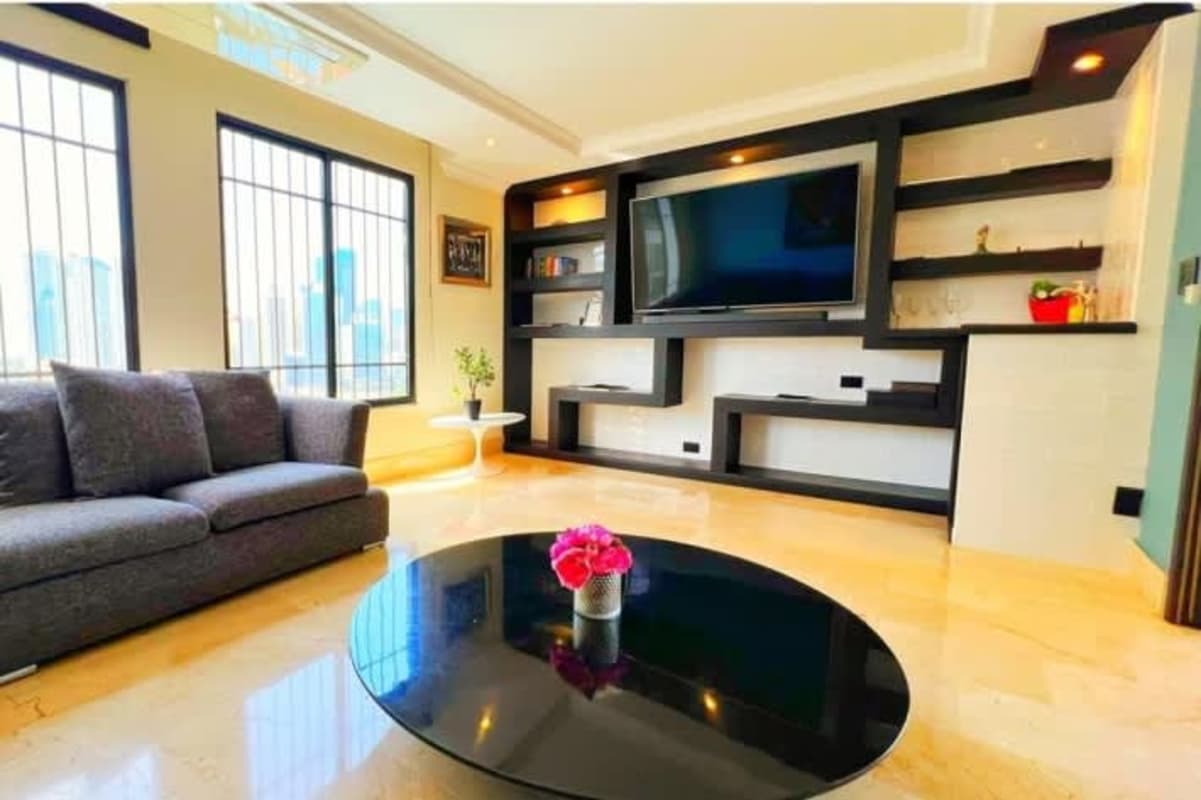 Elegant master bedroom with ensuite bathroom and skyline views PH Vista Mar Panama City