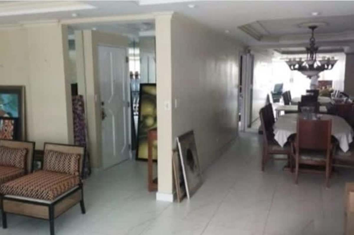 Open living dining area with neutral decor and tile floors PH Paitilla Panama City
