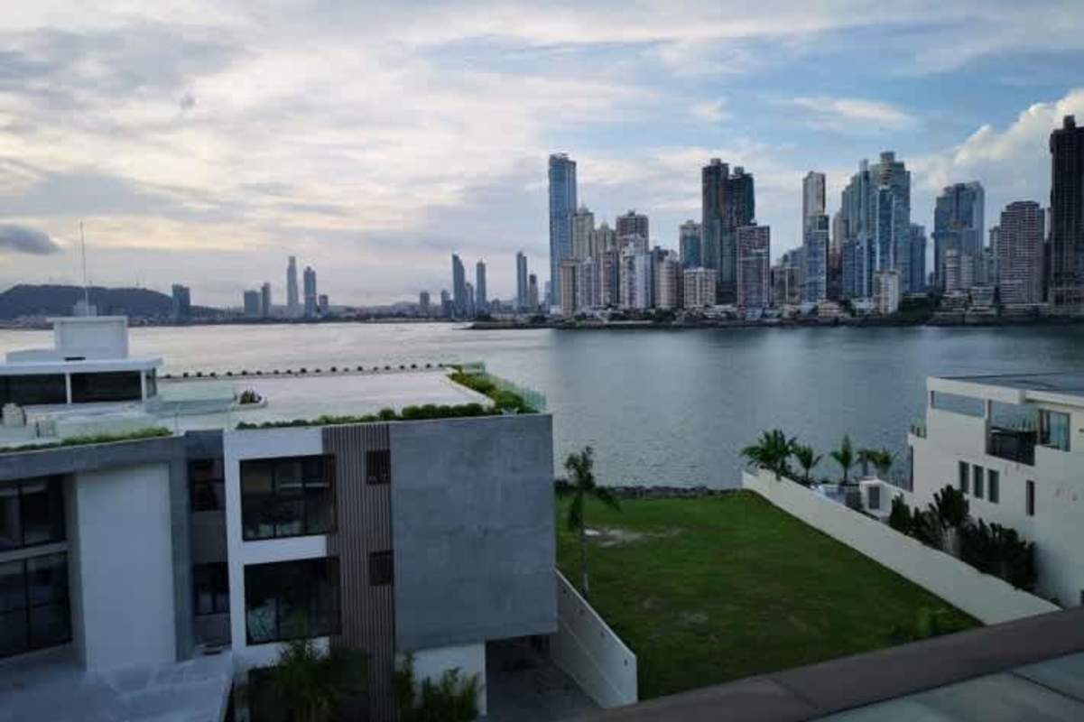 Living area with marble flooring and outdoor patio view luxury condo at Ocean Reef Islands Panama