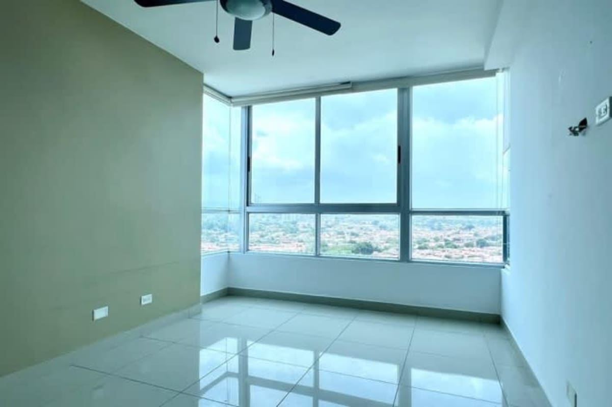 Bright bedroom with large windows, ceiling fan, neutral tones PH Top Towers Costa del Este Panama