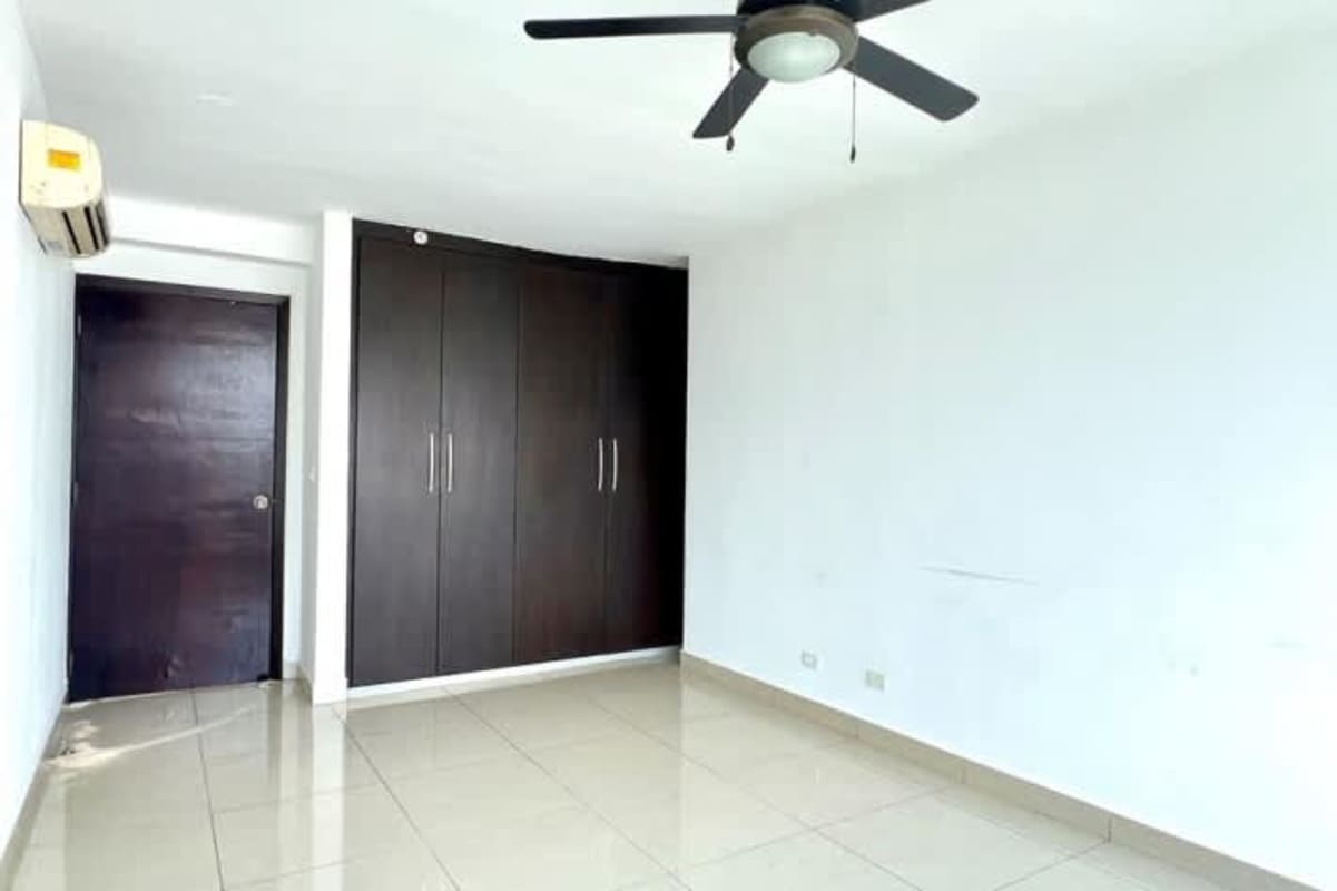 Bright living room with large windows, balcony access and skyline view PH Top Towers Costa del Este Panama