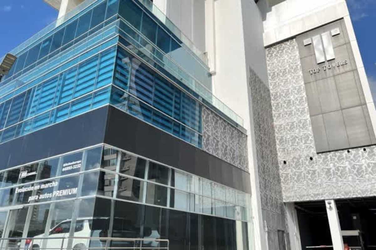 Modern commercial office building with blue glass facade in Costa del Este Panama