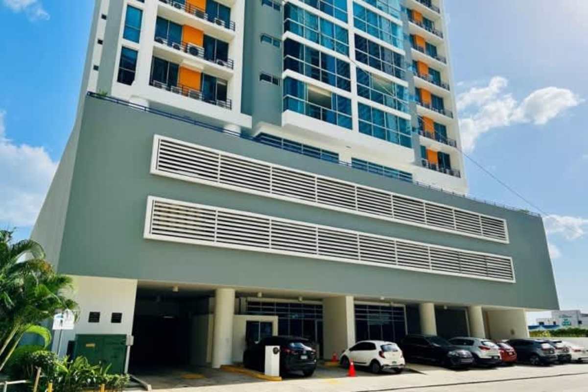 Exterior photo of PH Costa View condo building with balconies and parking area in Costa del Este Panama