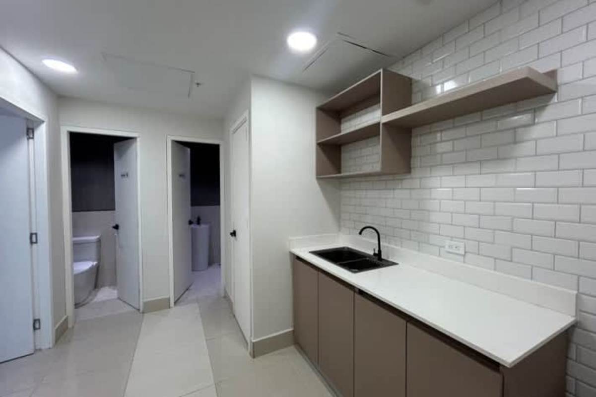 Reception counter and bright office workspace with glass walls in Prime Tower Panama