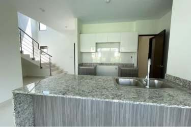 Modern kitchen with granite counters, cabinets, open design in Riverview Costa Verde, Panama