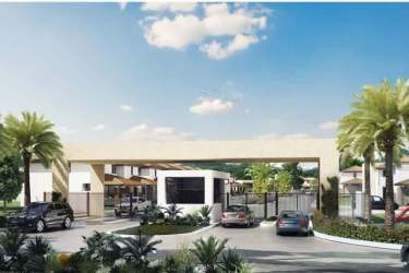 Secure gated entry with palm trees and driveway at Riverview Costa Verde Panama