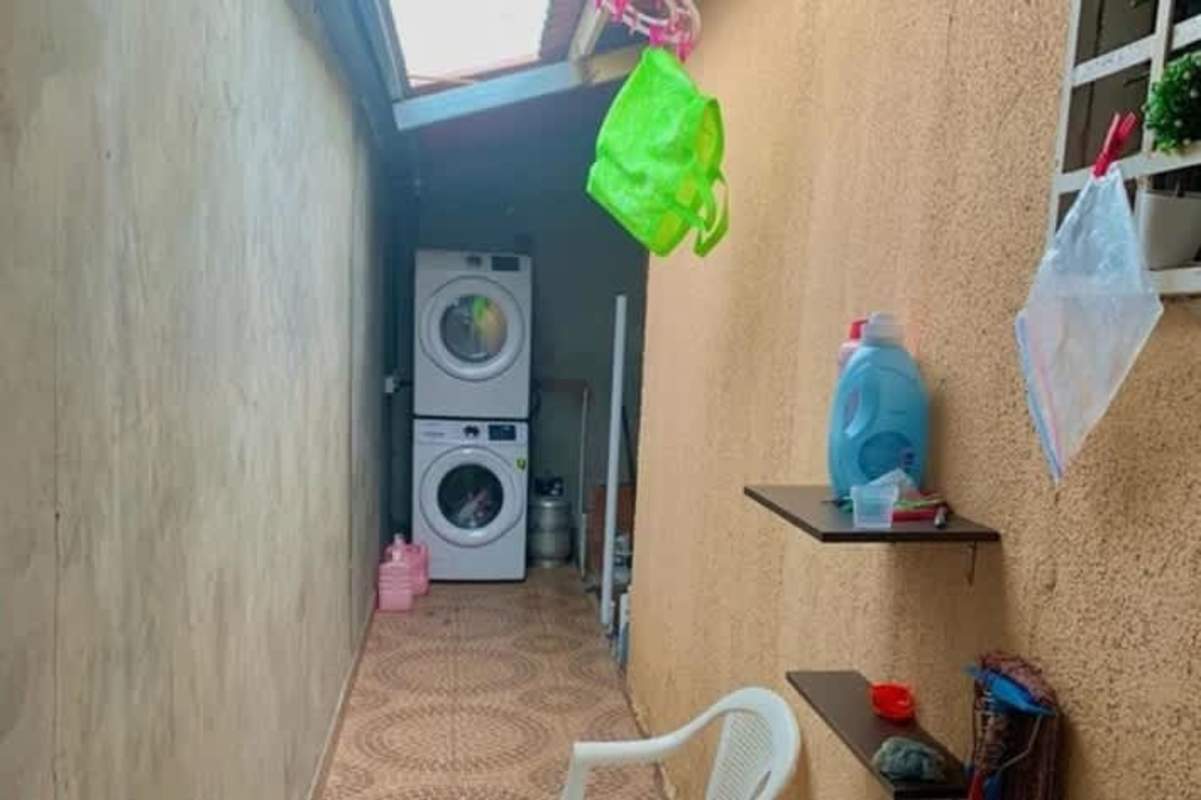 Laundry space skylight stacked washer dryer plastic chair Parque Villa Lucia Panama