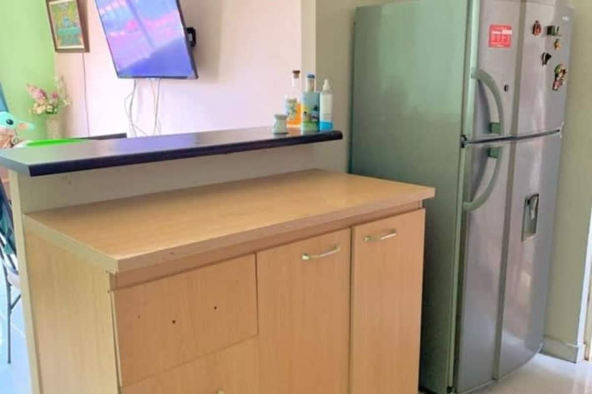 Light wood cabinetry kitchen with fridge, wall TV Parque Villa Lucia Tocumen Panama