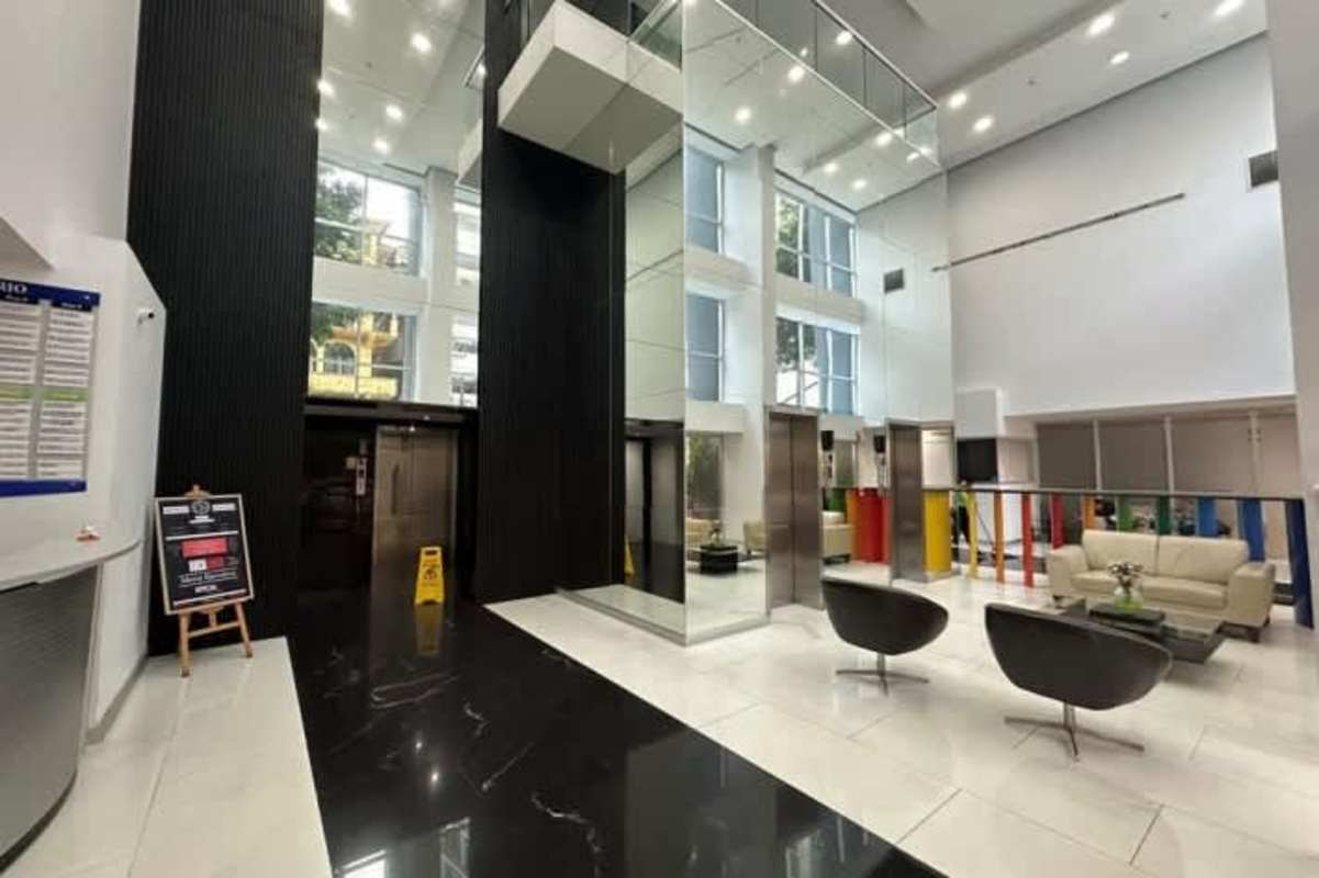 Modern furnished kitchen with island, oven, refrigerator at PH Colores de Bella Vista Panama