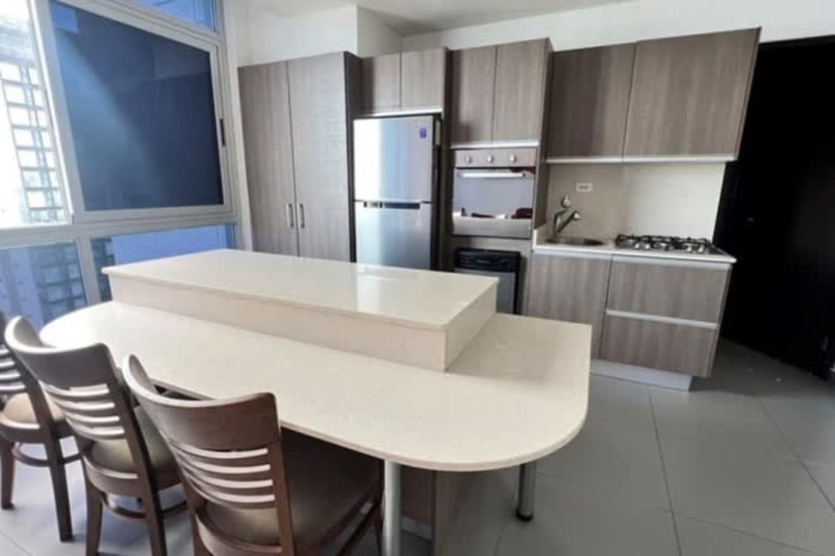 Bedroom area with large panoramic windows and ocean view at PH Colores de Bella Vista Panama