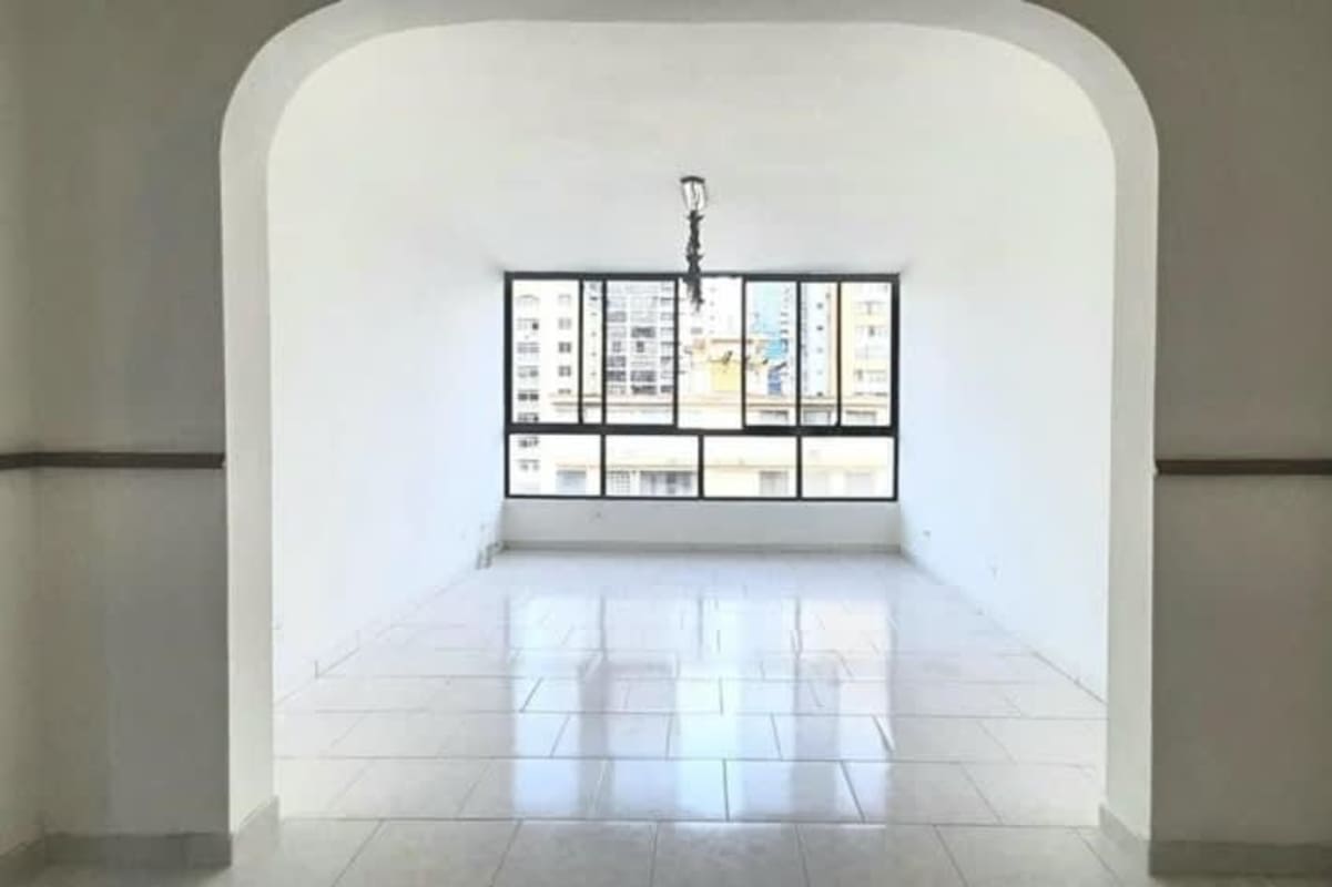 Bright empty living room with arched doorway and tiled floor in PH El Cangrejo Panama City