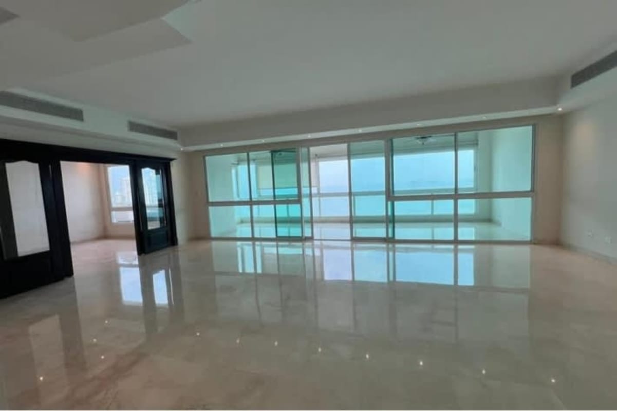 Bright living room with marble floors, ocean view windows in PH BICSA Financial Center Panama City