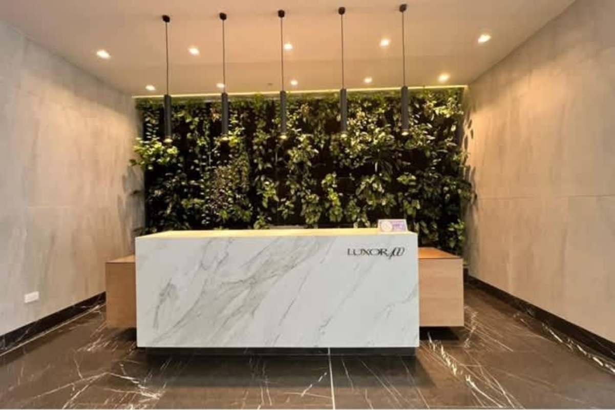 Marble reception and vertical garden wall in PH Luxor 400 lobby El Cangrejo Panama