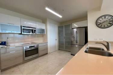 Open kitchen with granite counters and appliances at PH Casa Bonita Playa Bonita Panama City