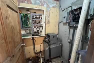 Open electrical panels and exposed wiring inside potential development Casco Antiguo Panama