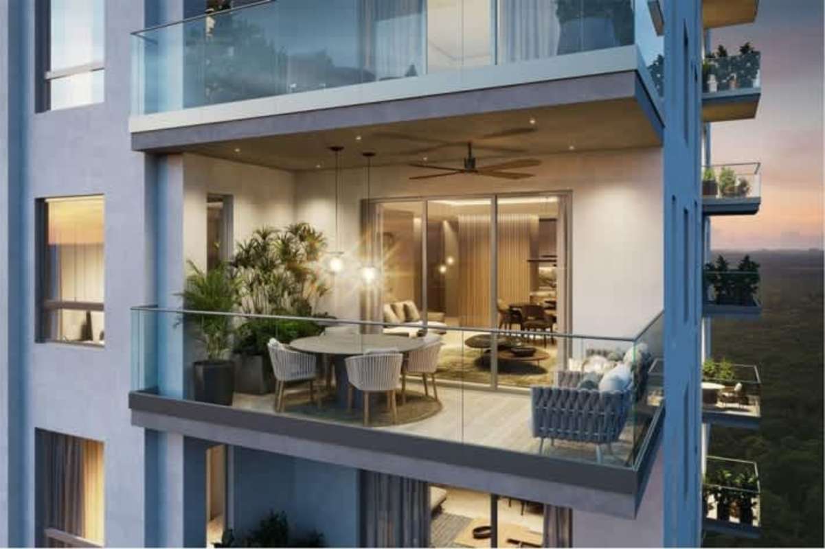 Spacious balcony with dining area, plants, and outdoor lounge at Santa Maria Panama condo