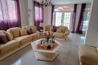 Entrance foyer with decorative railing staircase tiles Maria Leticia Panama house sale