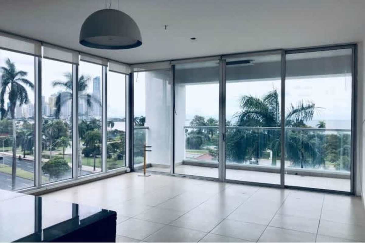 Modern living room with panoramic ocean views in PH Rivage Tower Panama City