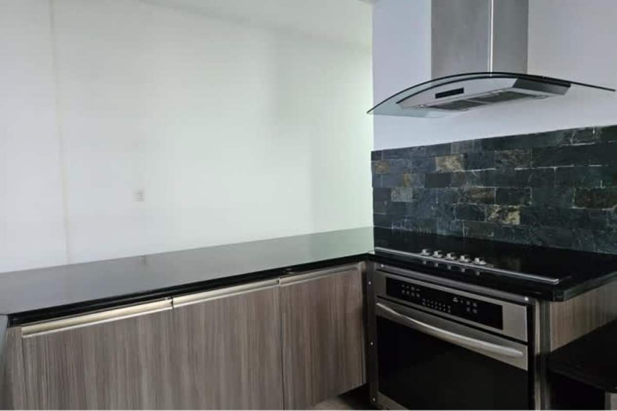 Modern bathroom with granite sink counter and glass shower in PH Rivage Panama