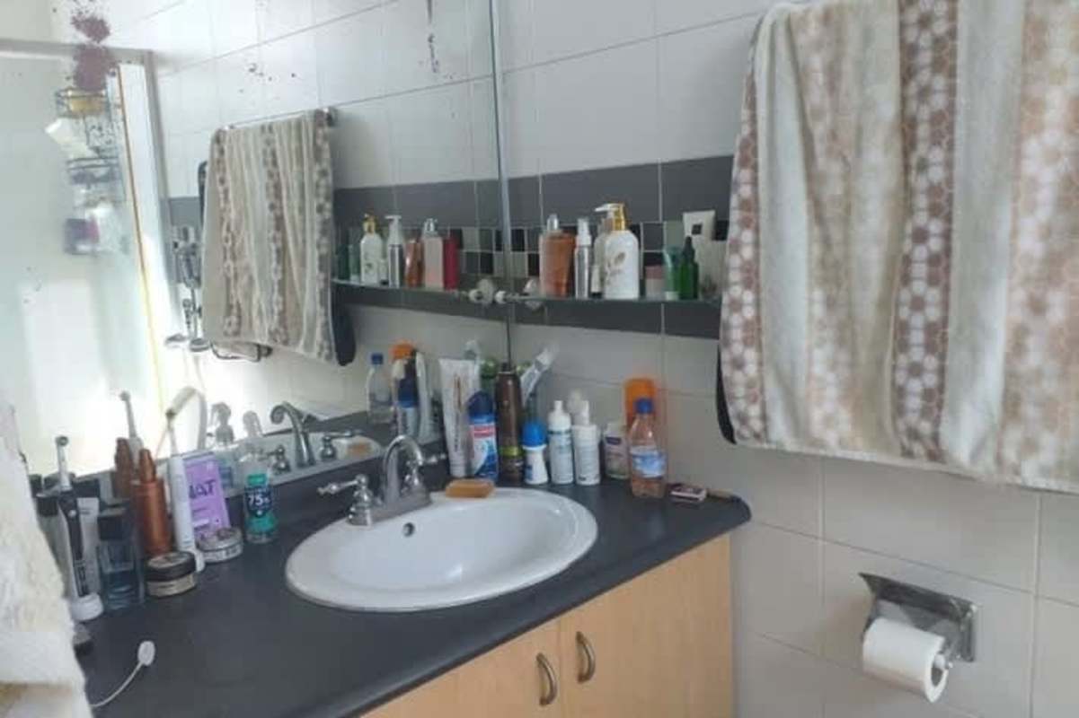 Bathroom interior with vanity, mirror and mosaic tile PH San Francisco Bay Panama