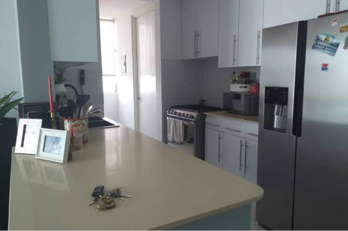 Modern bathroom with glass-enclosed shower, vanity, turquoise accents in PH San Francisco Bay Panama