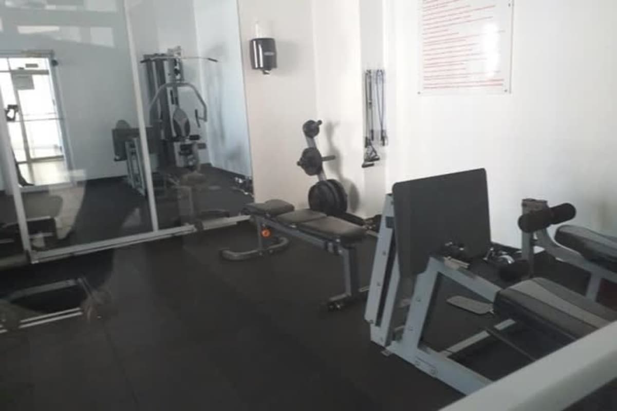 Kitchen with granite counters and stainless refrigerator PH San Francisco Bay Panama City