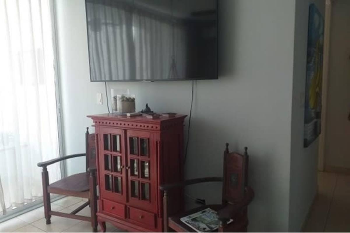 Contemporary dining area with glass table and art PH San Francisco Bay Panama City