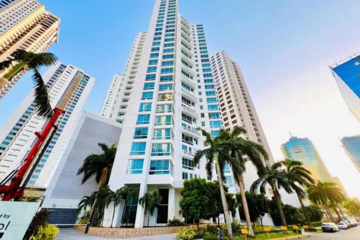 High-rise PH Castellammare Costa del Este with palm trees and landscaped entrance in Panama City