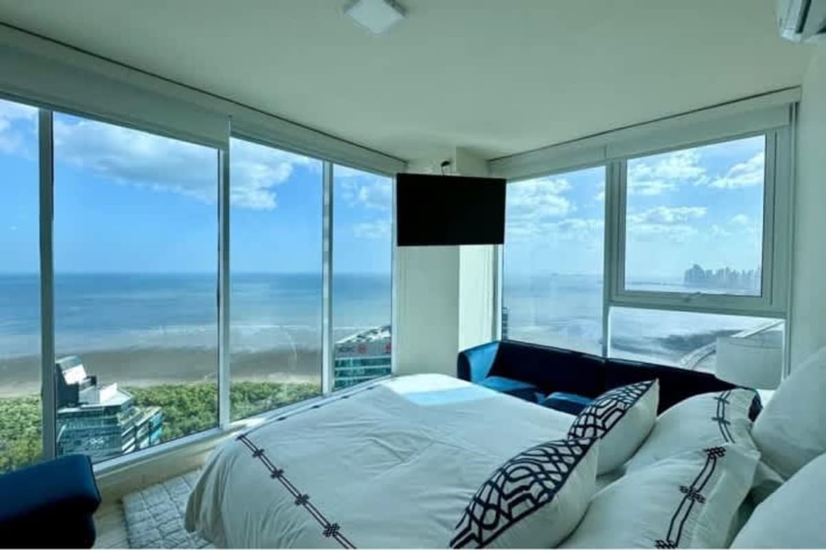 Bedroom with floor-to-ceiling windows panoramic ocean views PH Oceana Tower Costa del Este