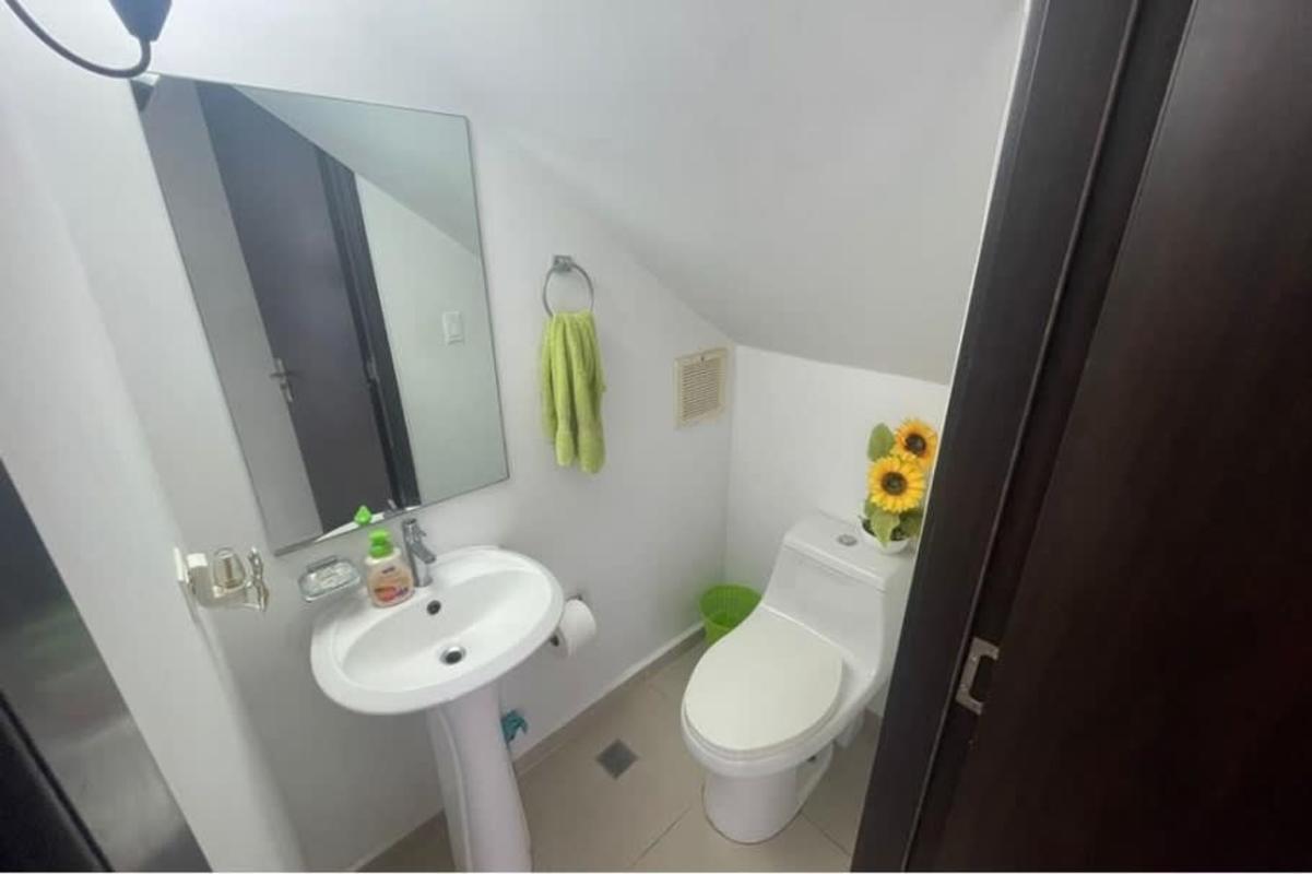 Bright bathroom with pedestal sink, walk-in shower and modern tiles Villasol Panama